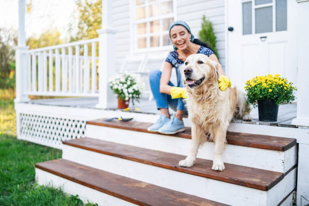 Woman with dog on porch
